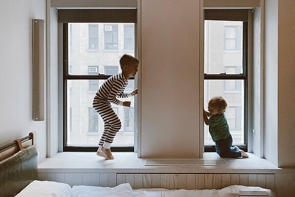 Two Kids two-kids-playing-beside-glass-windows-3273851.jpg